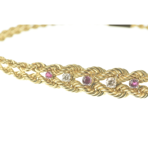 56 - A ruby and diamond 9ct gold bracelet, formed of twin rope-twist chains with a central tapering secti... 