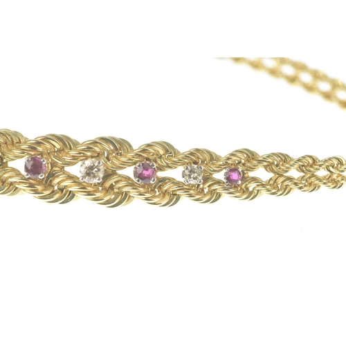 56 - A ruby and diamond 9ct gold bracelet, formed of twin rope-twist chains with a central tapering secti... 