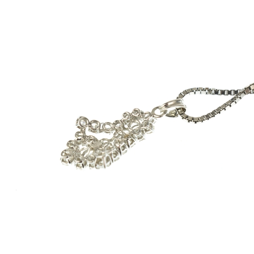 57 - A diamond cluster 18ct white gold pendant necklace, the pendant of tiered design set with round bril... 