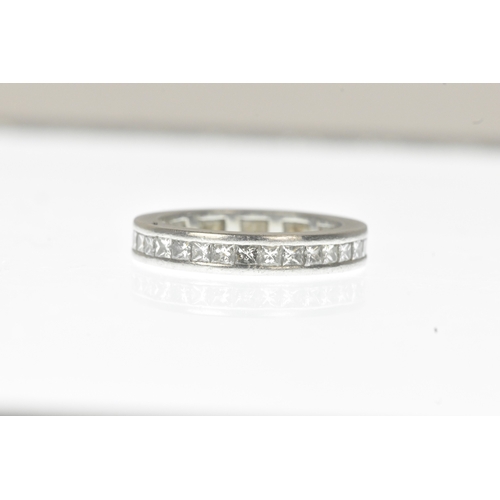 6 - A diamond white metal full-eternity ring, channel-set with a continuous row of princess-cut diamonds... 