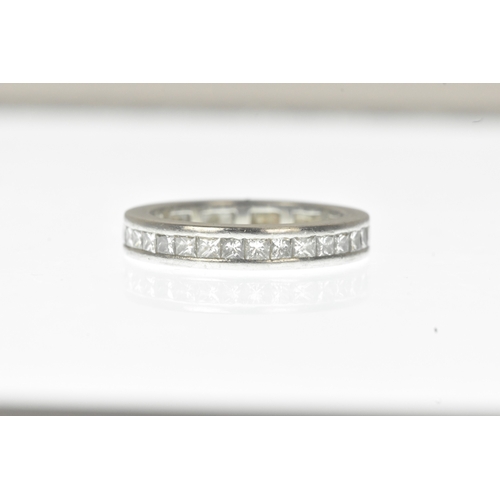 6 - A diamond white metal full-eternity ring, channel-set with a continuous row of princess-cut diamonds... 