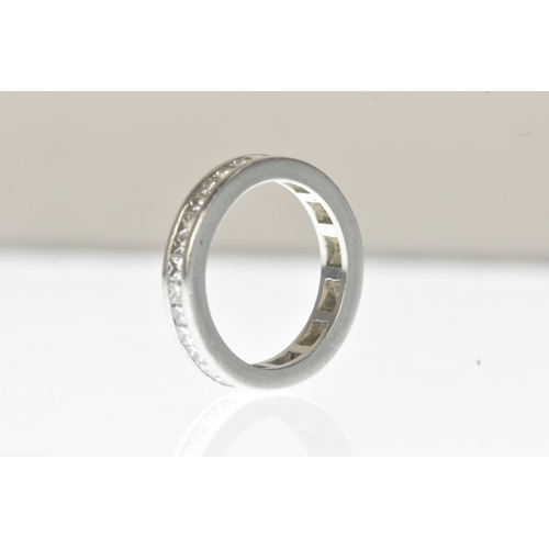 6 - A diamond white metal full-eternity ring, channel-set with a continuous row of princess-cut diamonds... 
