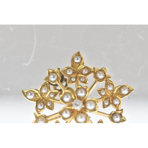 8 - A seed pearl and diamond yellow gold floral brooch, set throughout with seed pearls and centred by a... 
