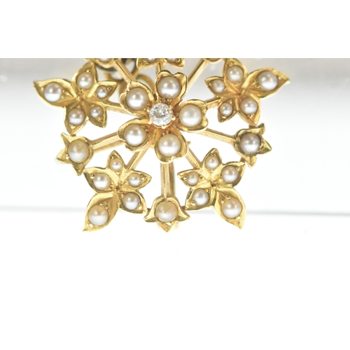 8 - A seed pearl and diamond yellow gold floral brooch, set throughout with seed pearls and centred by a... 