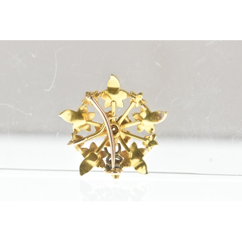 8 - A seed pearl and diamond yellow gold floral brooch, set throughout with seed pearls and centred by a... 