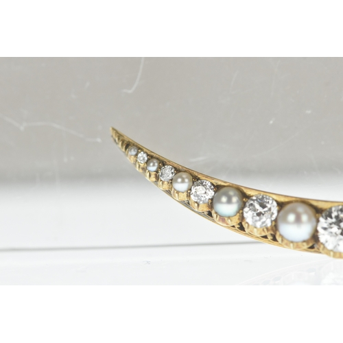 9 - A late Victorian diamond and pearl yellow gold crescent brooch, set with graduated old-cut diamonds ... 