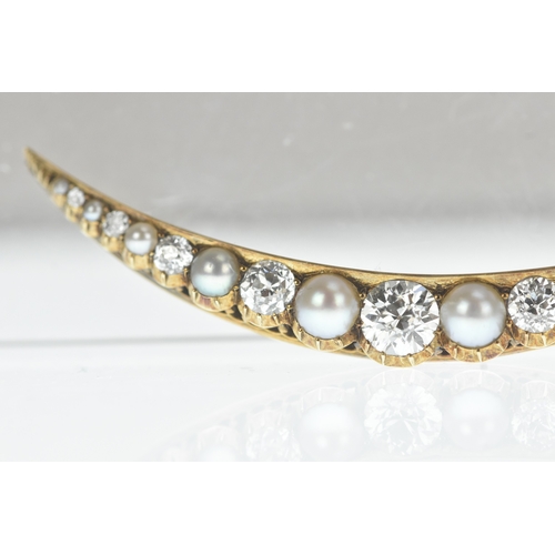 9 - A late Victorian diamond and pearl yellow gold crescent brooch, set with graduated old-cut diamonds ... 
