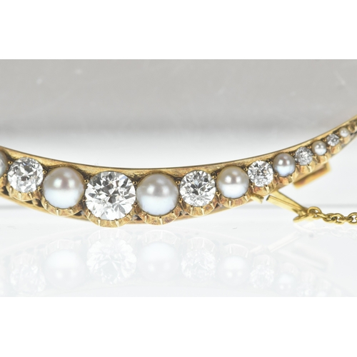 9 - A late Victorian diamond and pearl yellow gold crescent brooch, set with graduated old-cut diamonds ... 