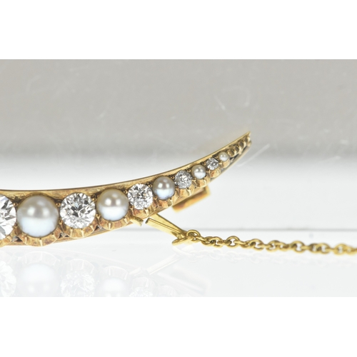 9 - A late Victorian diamond and pearl yellow gold crescent brooch, set with graduated old-cut diamonds ... 