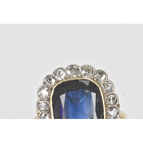 20A - An early 20th century synthetic sapphire and diamond 18ct gold cluster ring, the central cushion-cut... 
