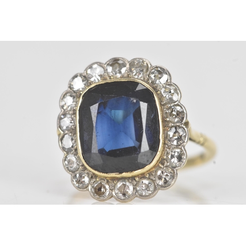 20A - An early 20th century synthetic sapphire and diamond 18ct gold cluster ring, the central cushion-cut... 