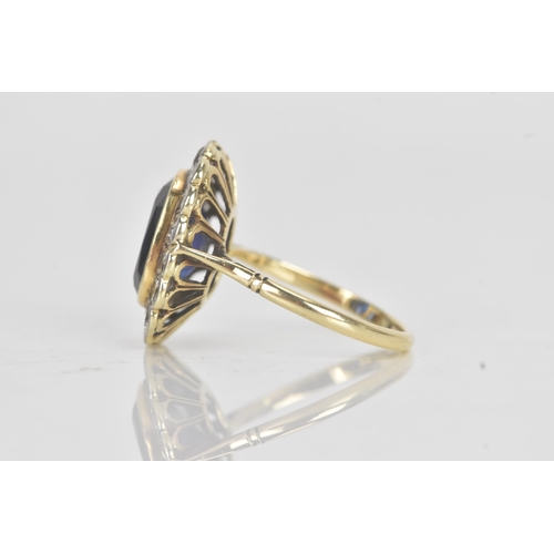 20A - An early 20th century synthetic sapphire and diamond 18ct gold cluster ring, the central cushion-cut... 