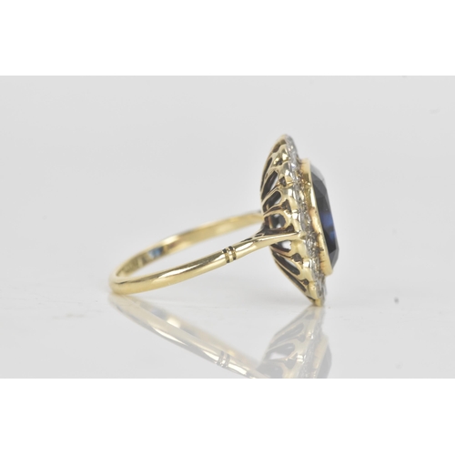 20A - An early 20th century synthetic sapphire and diamond 18ct gold cluster ring, the central cushion-cut... 