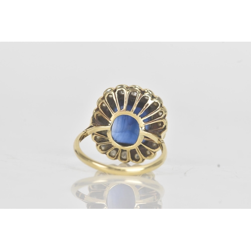 20A - An early 20th century synthetic sapphire and diamond 18ct gold cluster ring, the central cushion-cut... 