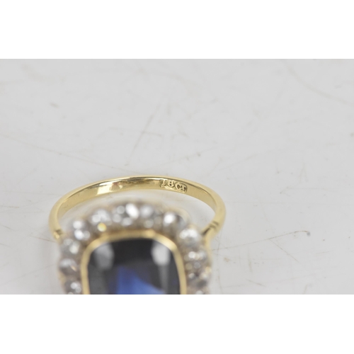 20A - An early 20th century synthetic sapphire and diamond 18ct gold cluster ring, the central cushion-cut... 