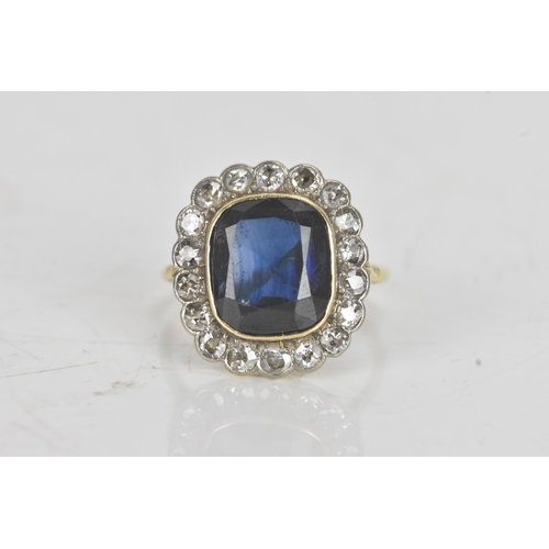 20A - An early 20th century synthetic sapphire and diamond 18ct gold cluster ring, the central cushion-cut... 