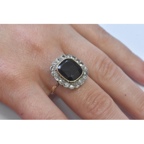 20A - An early 20th century synthetic sapphire and diamond 18ct gold cluster ring, the central cushion-cut... 