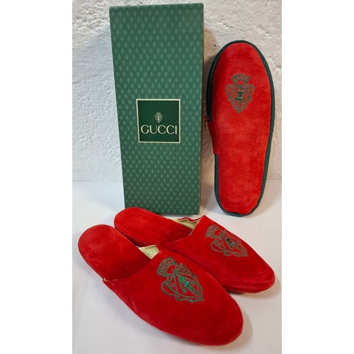 9 - Gucci- A pair of late 20th Century red slippers size 37 (on box) having a red zipped slipper case an... 