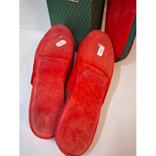 9 - Gucci- A pair of late 20th Century red slippers size 37 (on box) having a red zipped slipper case an... 