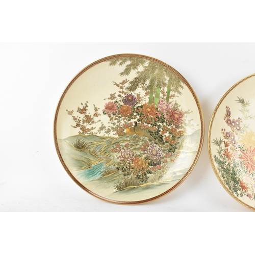 10A - Two Japanese hand-painted Satsuma chargers, mid 20th century, each of circular form and enamelled wi... 