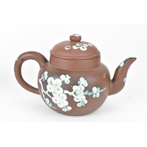 11 - A Chinese Yixing Zisha teapot and a vase, 20th century, the globular teapot with loop handle and sho... 