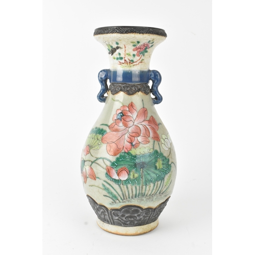 12 - A Chinese famille rose vase, late 19th to early 20th century, of baluster form with flared rim and t... 