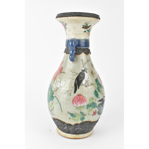 12 - A Chinese famille rose vase, late 19th to early 20th century, of baluster form with flared rim and t... 