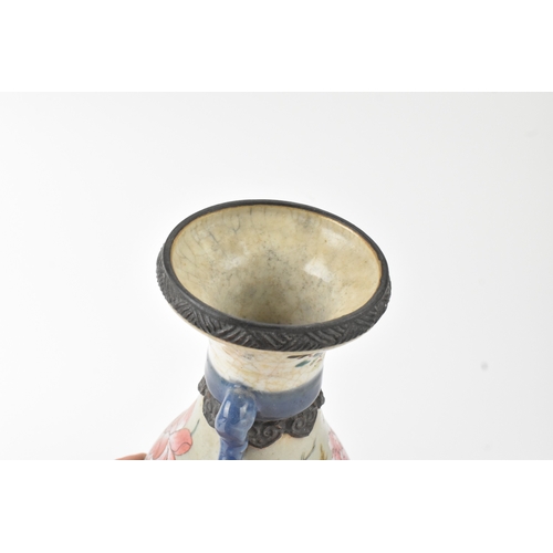 12 - A Chinese famille rose vase, late 19th to early 20th century, of baluster form with flared rim and t... 
