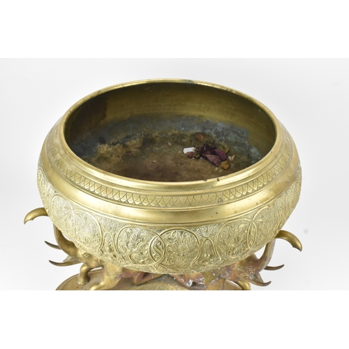 14 - A large Indian brass Paththara ceremonial bowl on elephant stand, early/mid 20th century, the bowl d... 