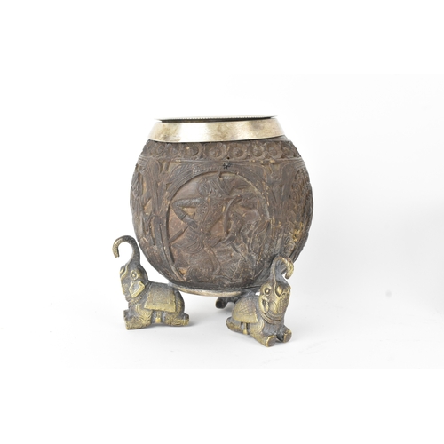 15 - Two Victorian Indian carved coconuts, one applied with Electro silver plate on brass mounts, each ca... 
