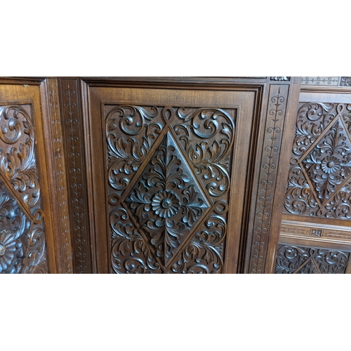 15A - A circa 1900 Chinese carved hardwood five-panel screen, reputedly from Peking Palace, each panel pro... 
