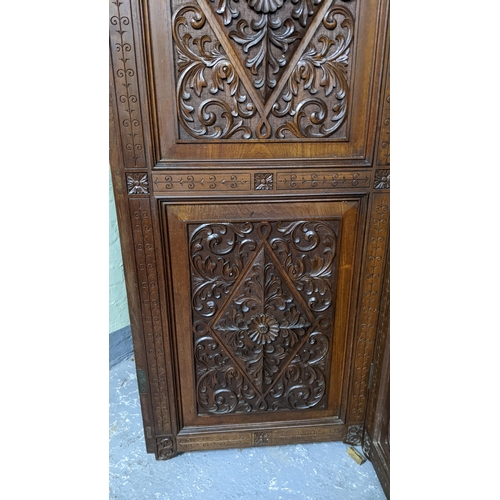 15A - A circa 1900 Chinese carved hardwood five-panel screen, reputedly from Peking Palace, each panel pro... 