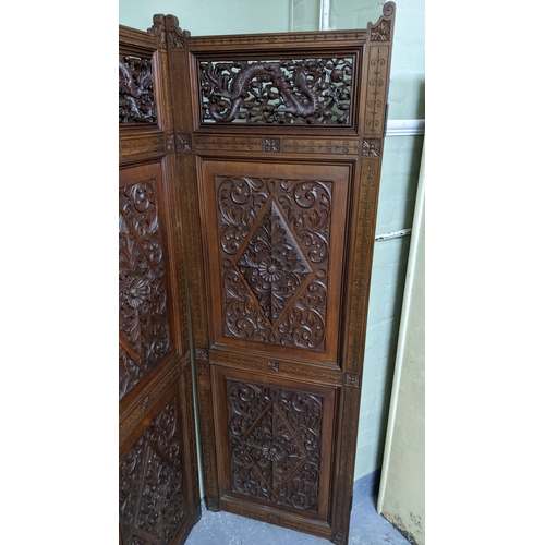 15A - A circa 1900 Chinese carved hardwood five-panel screen, reputedly from Peking Palace, each panel pro... 