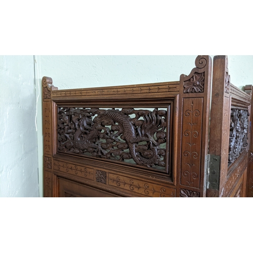 15A - A circa 1900 Chinese carved hardwood five-panel screen, reputedly from Peking Palace, each panel pro... 