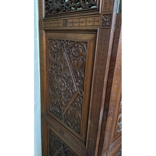 15A - A circa 1900 Chinese carved hardwood five-panel screen, reputedly from Peking Palace, each panel pro... 