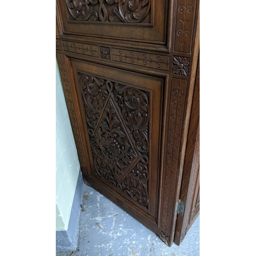 15A - A circa 1900 Chinese carved hardwood five-panel screen, reputedly from Peking Palace, each panel pro... 