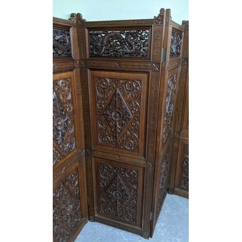 15A - A circa 1900 Chinese carved hardwood five-panel screen, reputedly from Peking Palace, each panel pro... 