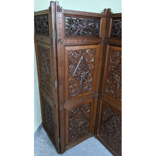 15A - A circa 1900 Chinese carved hardwood five-panel screen, reputedly from Peking Palace, each panel pro... 