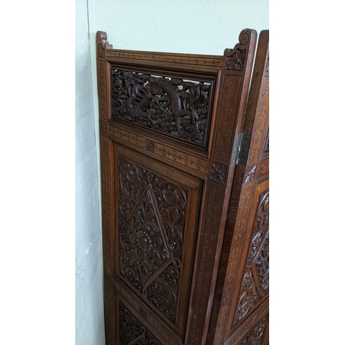15A - A circa 1900 Chinese carved hardwood five-panel screen, reputedly from Peking Palace, each panel pro... 