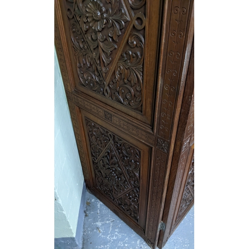 15A - A circa 1900 Chinese carved hardwood five-panel screen, reputedly from Peking Palace, each panel pro... 