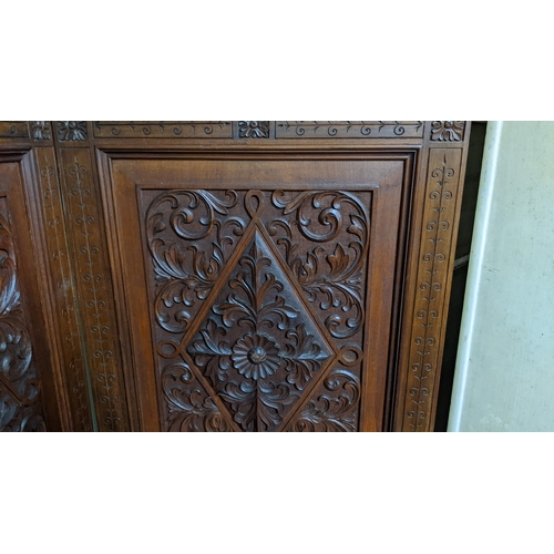 15A - A circa 1900 Chinese carved hardwood five-panel screen, reputedly from Peking Palace, each panel pro... 
