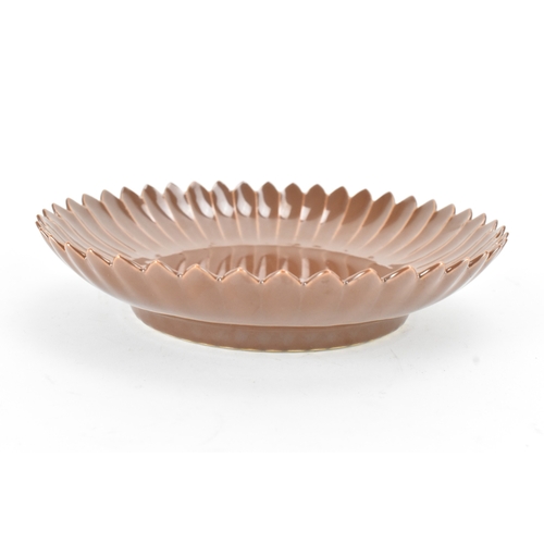 17 - A Chinese café-au-lait glazed chrysanthemum dish, 20th century, moulded with petals, the base with a... 