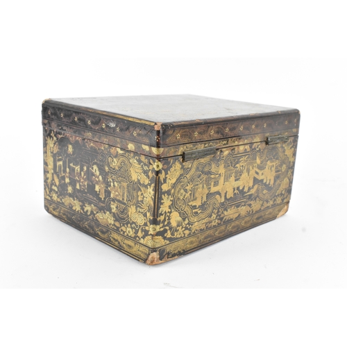19 - A Chinese export lacquer tea caddy, 19th century, of rectangular form, decorated in gilt with figure... 