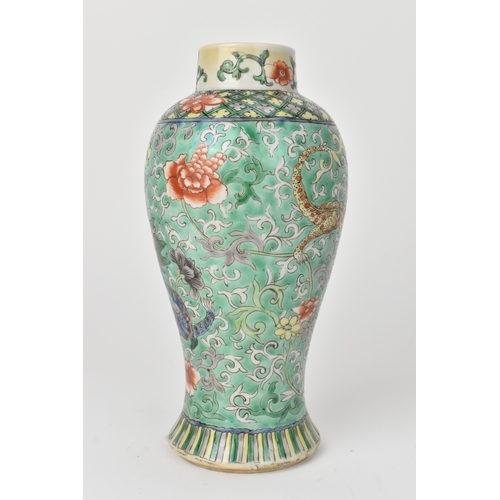 2 - A Chinese famille verte baluster vase, 19th century, enamelled with dragons among peony and scrollin... 