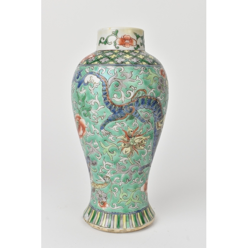 2 - A Chinese famille verte baluster vase, 19th century, enamelled with dragons among peony and scrollin... 