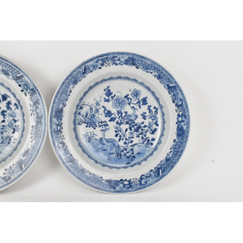 23 - A group of three Chinese Qing Dynasty blue and white porcelain plates, 18th century, each painted to... 