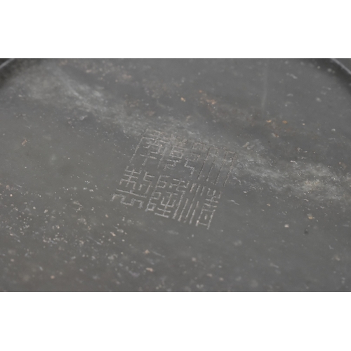 27 - A Chinese spinach green jade bowl, of circular shallow form with recessed footrim, the underside inc... 