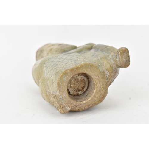 28 - A Chinese carved hardstone figure and an archaistic hardstone blade-form carving, the figure modelle... 