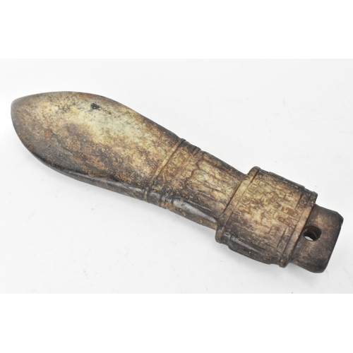28 - A Chinese carved hardstone figure and an archaistic hardstone blade-form carving, the figure modelle... 