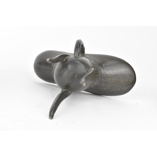 29 - A pair of Chinese bronze tripod vessels, comprising a ding with engraved decoration and an apocrypha... 